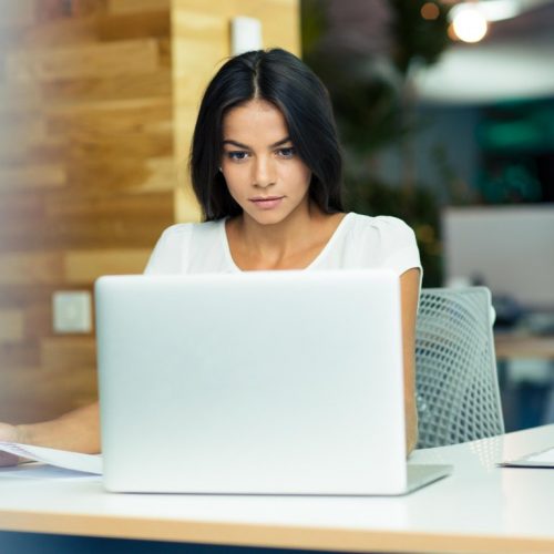 Portrait of a lovely businesswoman working in office
